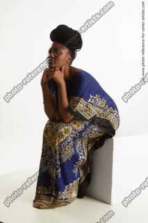 Dina Moses African Woman Sitting Pose